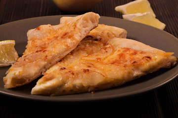 Pizza with pears, cheeses and nuts on chopped dough