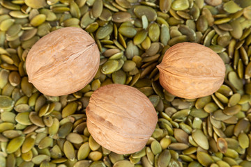 inshell walnut in the shell on pumpkin seeds