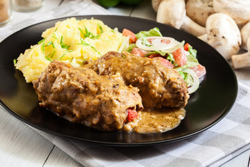 Pork rolls in sauce