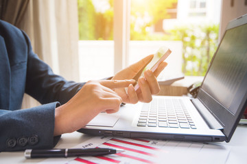 Business woman using smart phone in work at office 