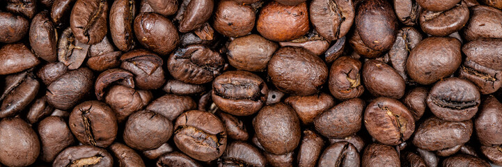 Coffee beans background texture panoramic banner.
