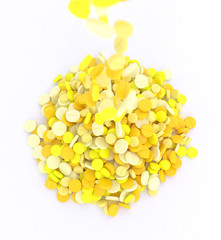 big pile of yellow pills on white background close up, 3d illustration