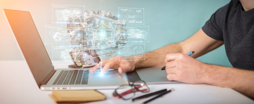 Graphic designer using wireframe holographic 3D digital projection of an engine