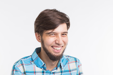 Laughing bearded handsome man on white background