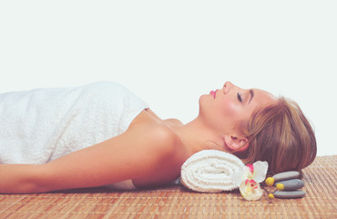 Obraz na płótnie Canvas Closeup of an attractive young woman receiving massage .