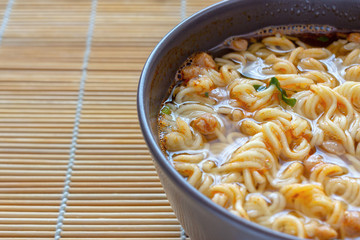 Ramen noodles in a brown cup