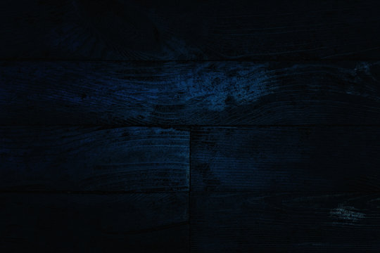 Dark Wooden Texture With Partially Shiny Blue Surface Close-up