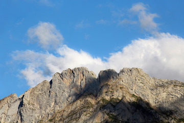 Fototapeta na wymiar Mountain Peak And Clouds