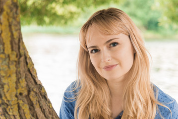 Fototapeta premium Beautiful woman on nature. Woman on a walk.