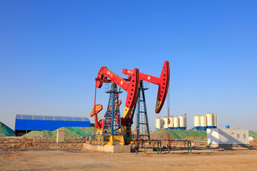 Pumping unit and bituminous concrete mixing station under blue sky