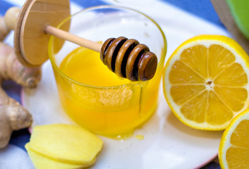 Lemon, honey, turmeric and ginger on White Table for Home Treatment. Healthy concept