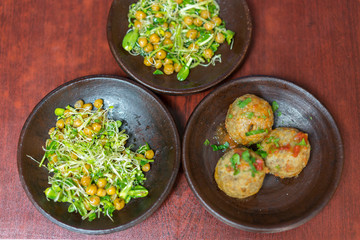 Vegetarian food. Buckwheat Salad and Cutlets. buckwheat burgers. healthy food on a brown background.