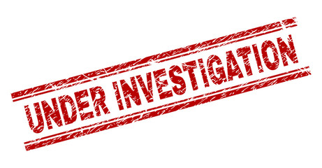 UNDER INVESTIGATION seal imprint with distress texture. Red vector rubber print of UNDER INVESTIGATION text with unclean texture. Text caption is placed between double parallel lines.