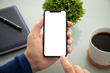 male hands holding phone with isolated screen in the office