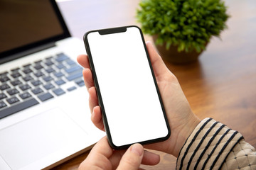 female hands holding phone with isolated screen in the office