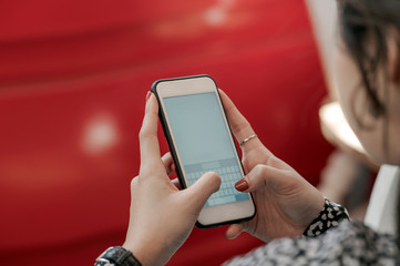 short of businesswoman using  smartphone at the office.