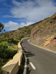 High slope mountain road with cyclists in Tenerife