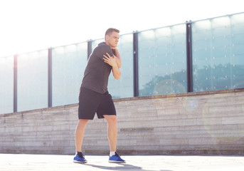 Obraz na płótnie Canvas Young and sporty man training outdoor in sportswear. Sport, health, athletics.
