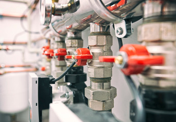 Fototapeta premium A lot of different faucets and other equipment for boiling room