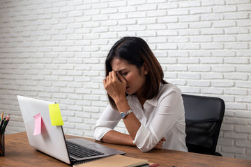 Desperate businesswoman worried in office