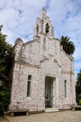 Fototapeta na wymiar San Caralampio church in La Toja Island, covered of scallop shells, in Galicia, Spain.