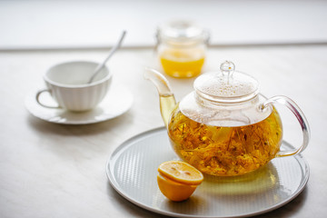 cup of tea with teapot and cup of tea
