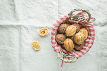 Delicious walnut shaped shortbread sandwich cookies filled with sweet condensed milk, top view