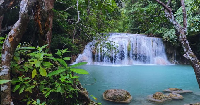 Peaceful nature background of waterfall in tropical jungle forest