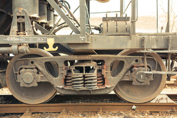 Details from train rail wagon. Springs and wheels.
