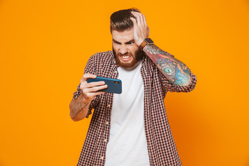 Portrait of an angry young man wearing casual clothes