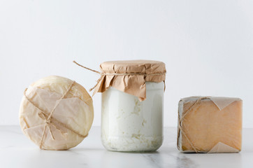 Row of assortment of cheese on table.Gouda, ricotta,provolone.Traditional  tasty cheese against...