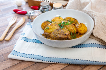 Piece of roasted pork and potatoes