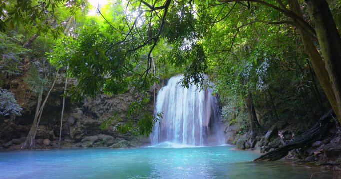 Idyllic waterfall peaceful scene. Pristine nature of tropical jungle forest in Thailand