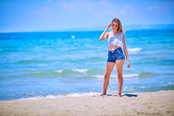 Fototapeta na wymiar Happy Girl having fun on tropical beach