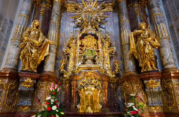 Fototapeta na wymiar Main shrine of Church of Our Lady Victorious and St. Anthony of Padua - statue of Infant Jesus of Prague, Prague, Czech Republic