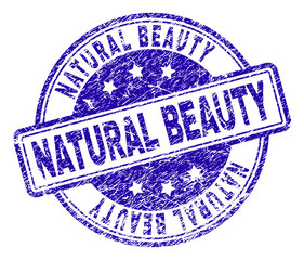 NATURAL BEAUTY stamp seal imprint with grunge style. Designed with rounded rectangles and circles. Blue vector rubber print of NATURAL BEAUTY label with grunge texture.