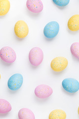 Background with pale pink, blue, yellow  Easter eggs. Compositions in pastel colors.  Easter concept