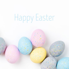 Background with pale pink, blue, yellow and gray Easter eggs. Compositions in pastel colors.  Easter concept