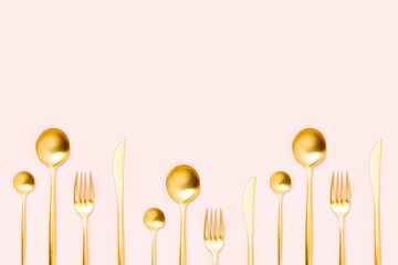 Pattern made of cutlery on pastel background, flat lay, top view. Minimalist concept.
