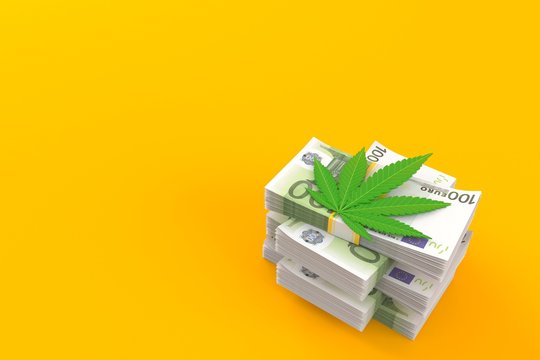Cannabis Leaf On Stack Of Money