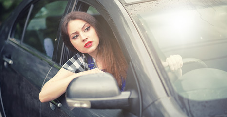 Fototapeta na wymiar Girl driving a car bad emotions