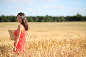 Obraz premium Summer landscape and a girl on nature walk in the countryside.
