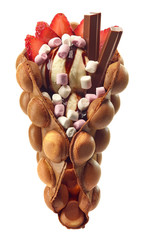 Hong kong or bubble waffle with ice cream, chocolate and strawberries