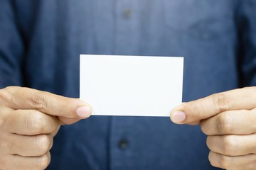 People man hand hold business cards show blank white card mock up. or pasteboard credit name card display front. Business branding concept.