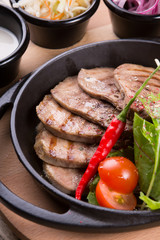 Fired beef tongue served with chili pepper