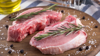 Raw meat  with rosemary. Closeup