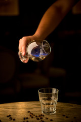 Bartender pouring burning absinthe