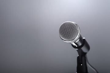Microphone on grey background.