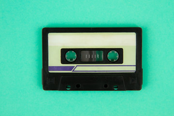 Retro cassette tape a on bright green  background