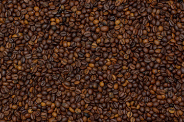 Coffee beans texture. Coffee background. Сoffee grain. Background image of many coffee beans filling the picture